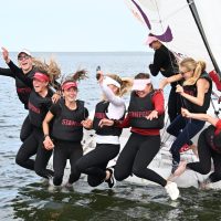 The Stanford sailing team celebrates winning their third straight Women's Team Racing national championship.