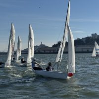 A crowded windward mark rounding at City Champs.