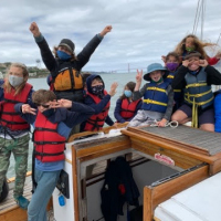 Enthusiastic-campers-enjoying-a-sail-on-Seaward