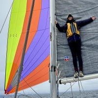 Aboard FeelinGood, her Corsair Dash 750 trimaran, Dafna Brown keeps the mainsail in shape during the downwind run from Santa Cruz to Moss Landing in the Little Boreas Regatta. - 