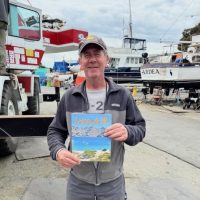 Roger Rudd gets his new copy at Berkeley Marine Center!