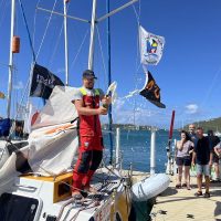 Josh Kali celebrates at the docks in Antigua with fellow competitors.