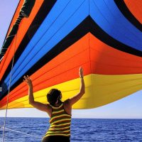 Chilean-capitan-Maya-flying-the-chute-across-the-sea-of-Cortez-on-Jason-Hites-Caribbean-50-ketch-Volaré-Jason-Hite