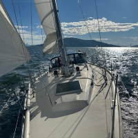 Fast is fun but we put in a reef in the light air as sailing flat is relaxing for family Sunday sails.  © John Arndt