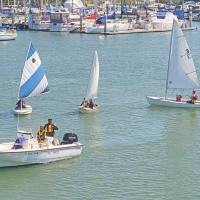 Even a small club can run a small-scale junior program with almost no budget: Dig up three small sailboats and a handful of kayaks, and let the