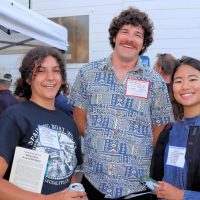 Spaulding apprentice, Jolene, with the timeless classic, Sailing Alone Around the World, met up with Mike and Yuen at the Crew Party.