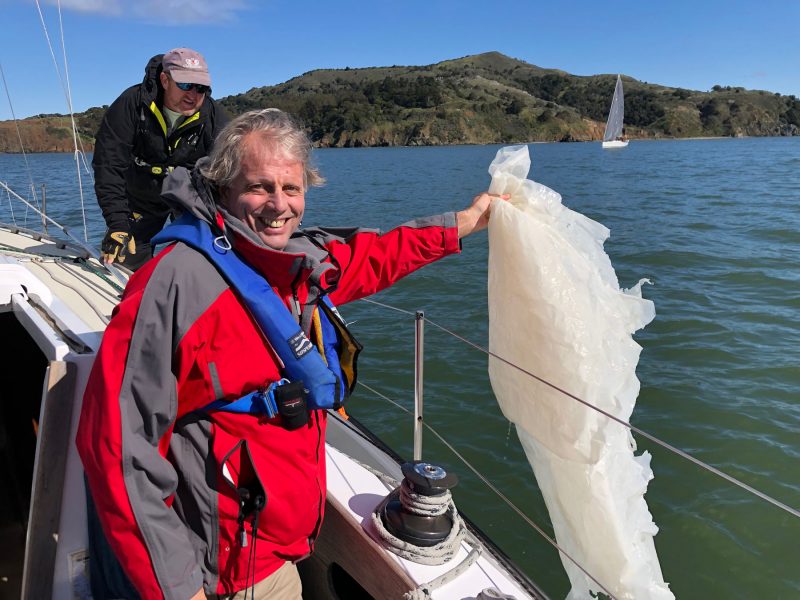 Pulling a plastic sheet from San Francisco Bay