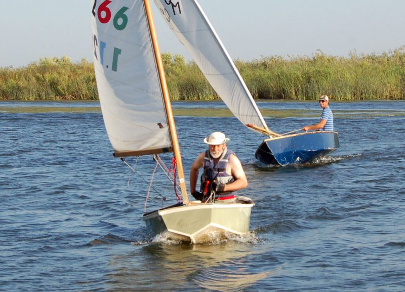 Men racing dinghies