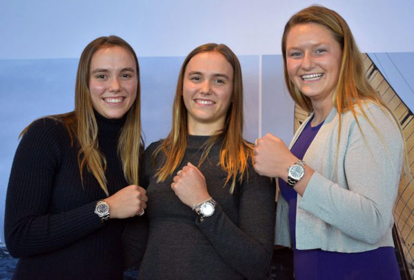 Three teenage girls with Rolex watches