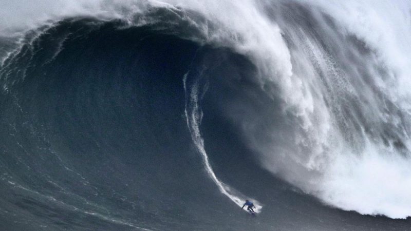 surfer on huge wave