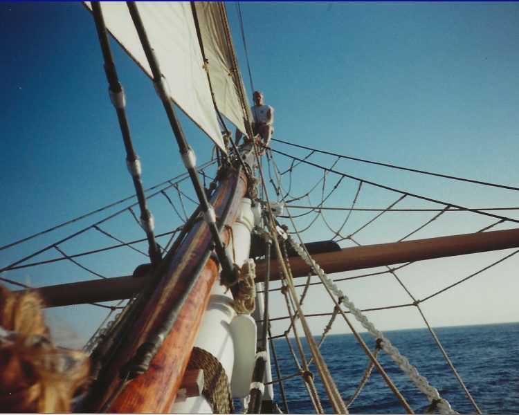 Captain Jim climbing to the tip of the bowsprit of Pilgrim