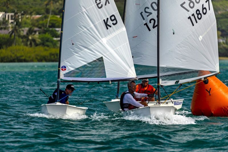 Three champion El Toro Senior sailors, including Jesse Andrews, round the weather mark in the El Toro North American championships.