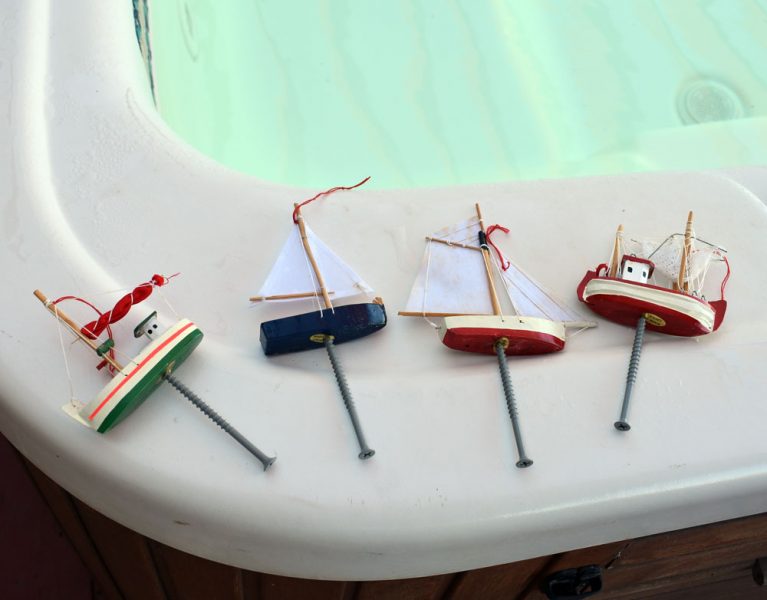 Boat ornaments with screws in the bottom