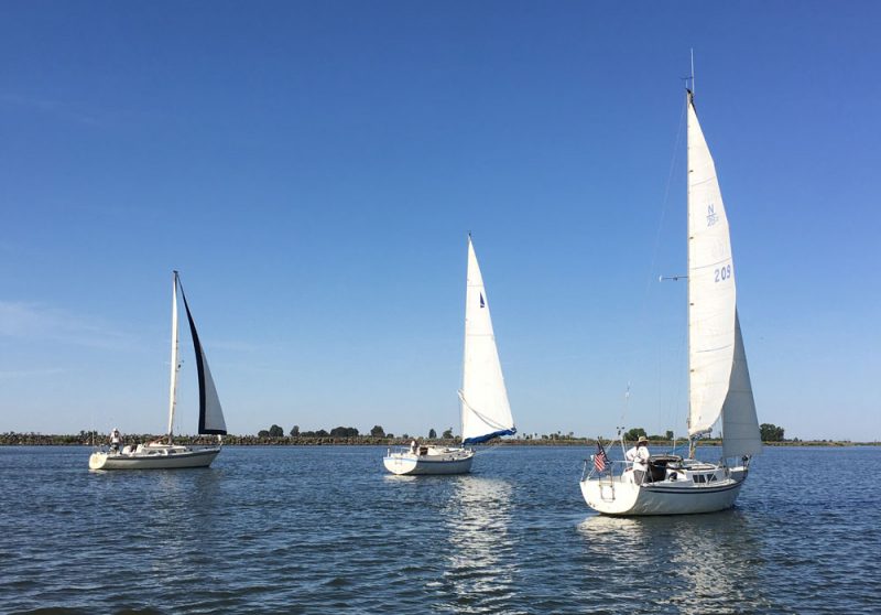 Three boats sailing on the San Joaquin River