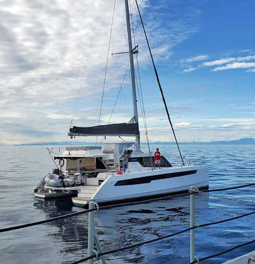 wong solo sailor aboard catamaran