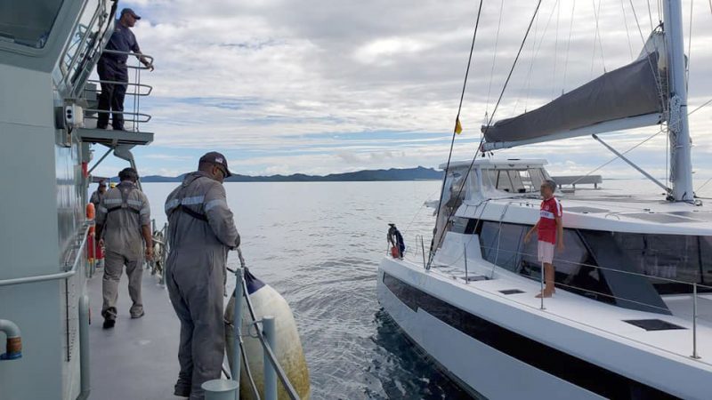 Navy sailors approach cat