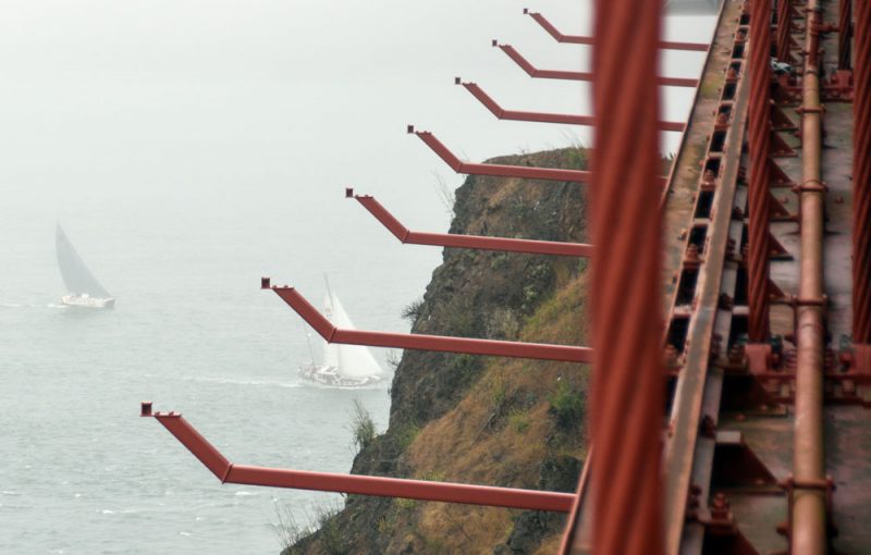 boats sailing under the Golden Gate Bridge
