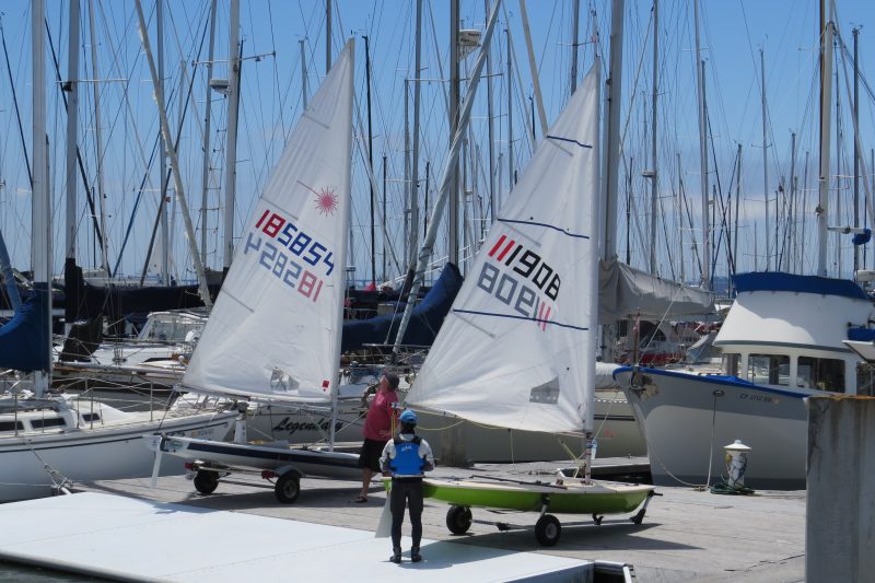 Jeff Holder and Toshi Takayanagi finish rigging on the dock at Richmond