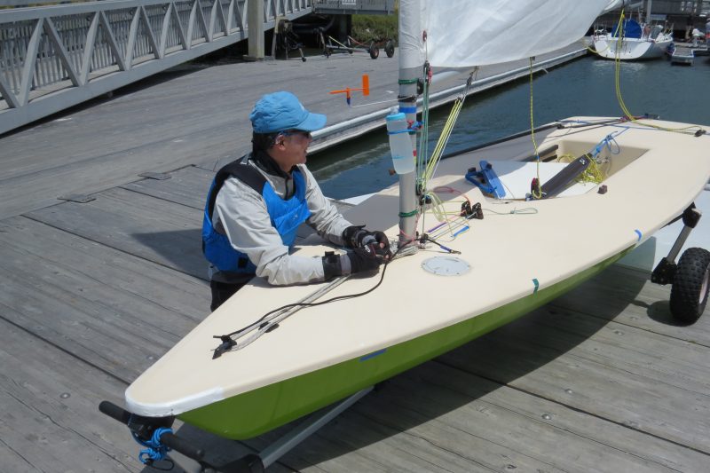 Toshi Takayanagi is rigging his green Laser