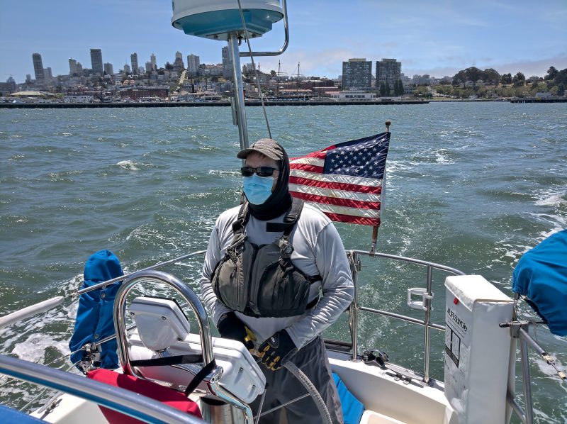 Masked sailor at the helm
