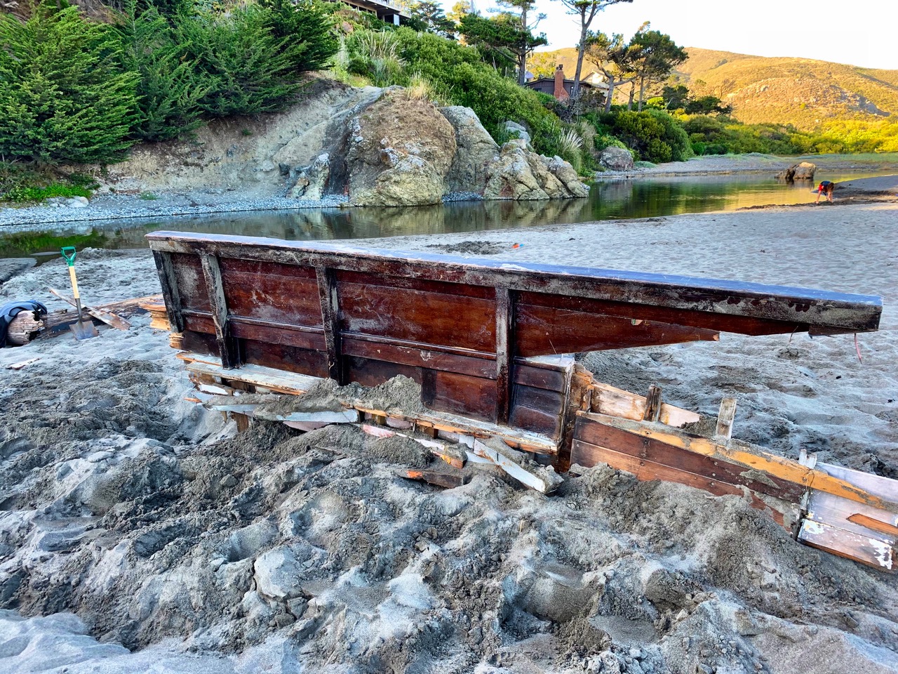 Upright boat piece after being dug out.