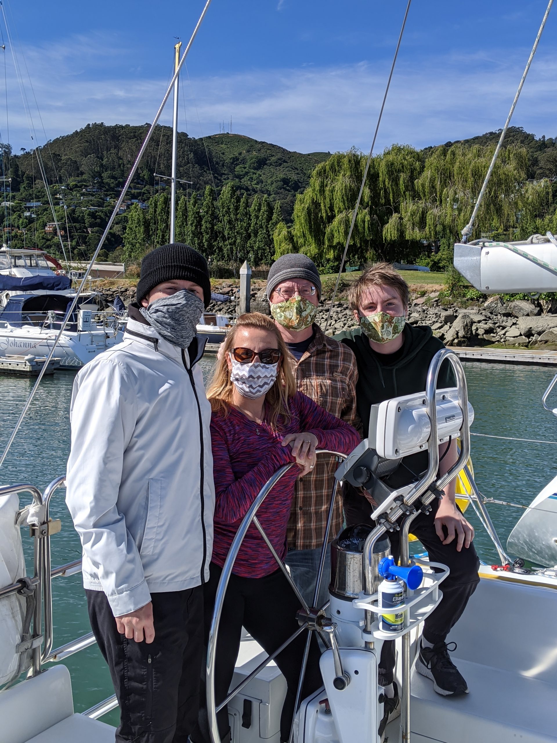 David, Maggie and family at the helm.