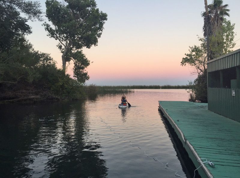 paddlers at sunset in the Delta