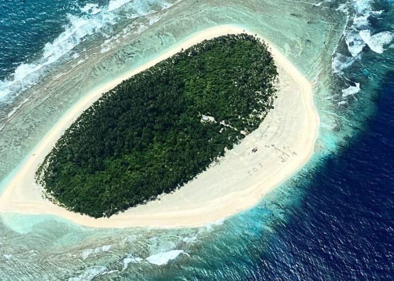 S.O.S. as seen from the air on Micronesian island.