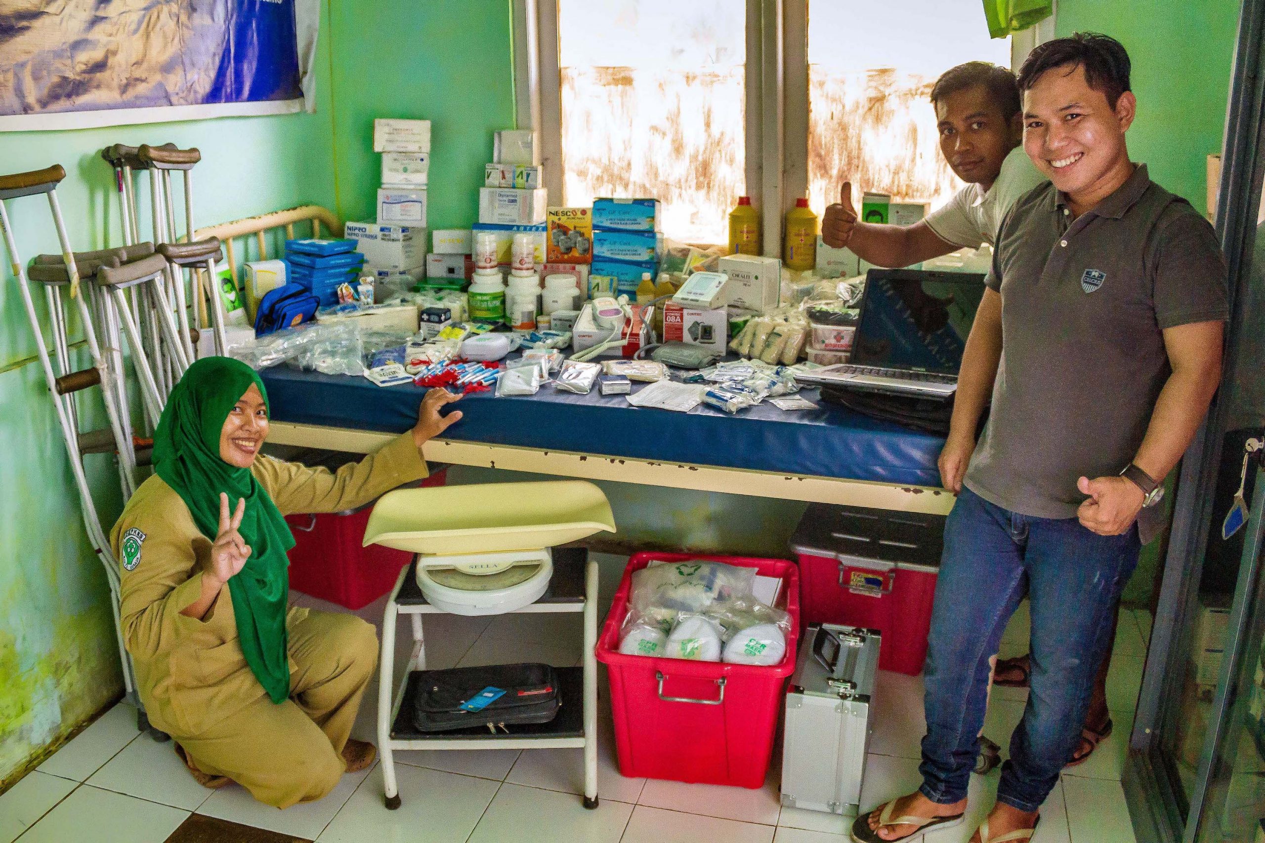 Local workers sort health supplies delivered by Vega