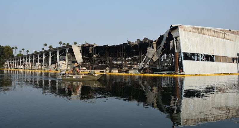 Partially damaged dock with boom