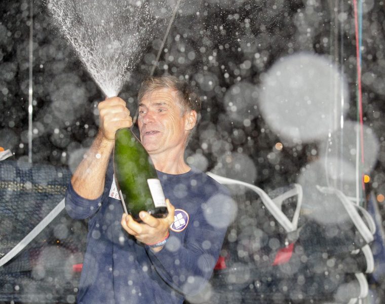 Fred Duthil sprays champagne