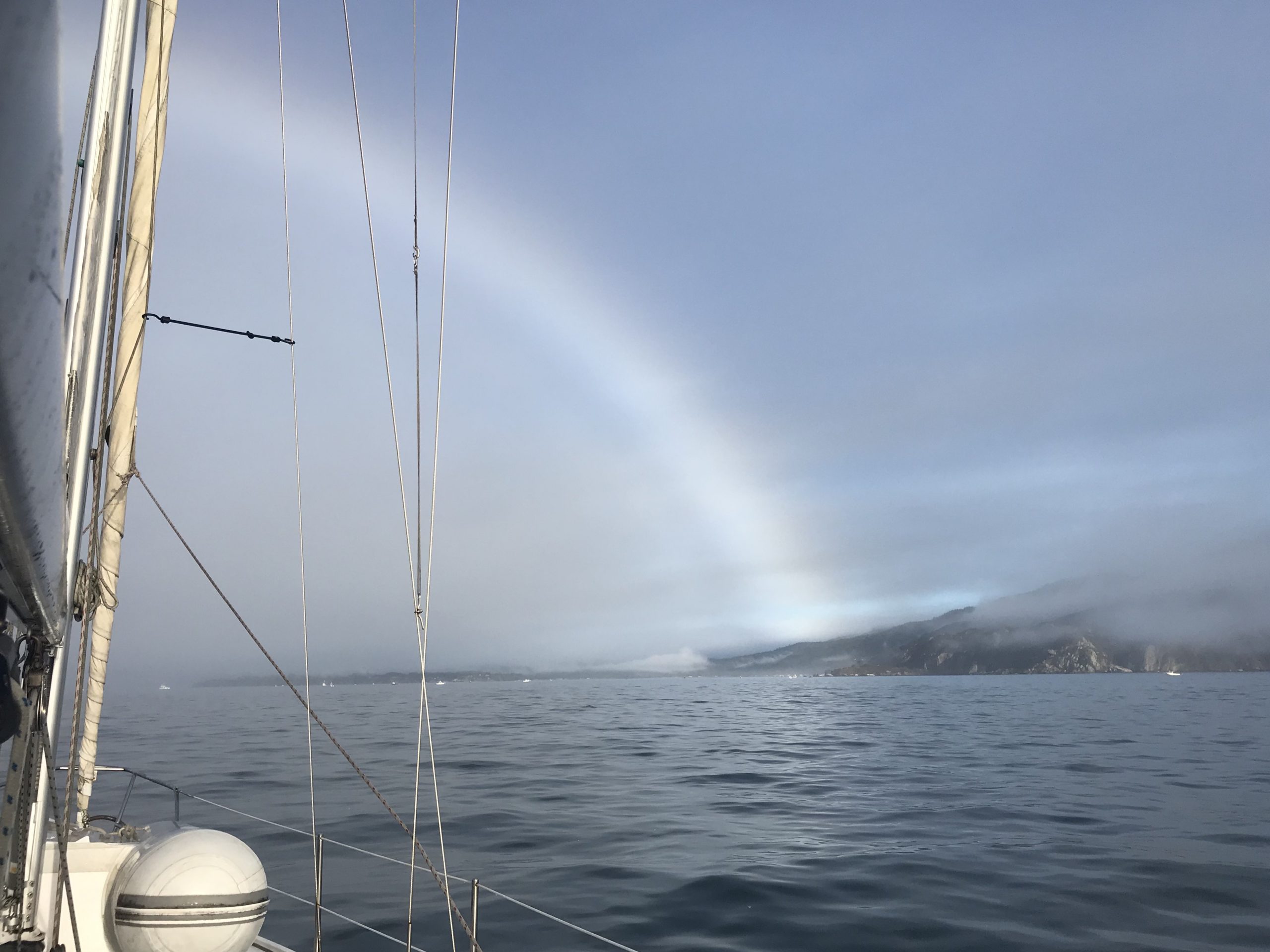 Fogbow landing on shore