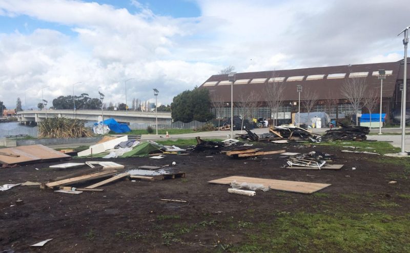 Homeless encampment adjacent to Cryer & Sons building