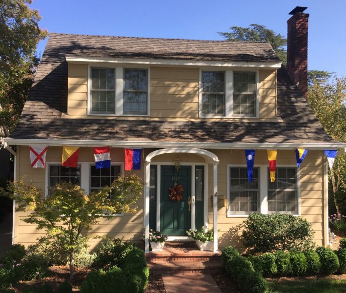 house with signal flags hoisted