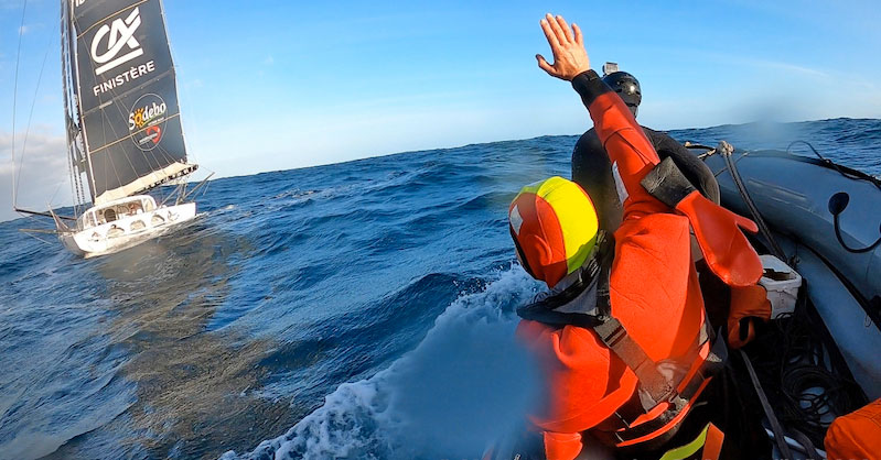 Escoffier waves from his liferaft