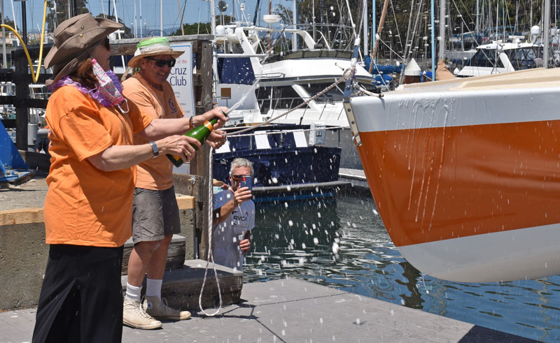 Christening the bow with champagne.