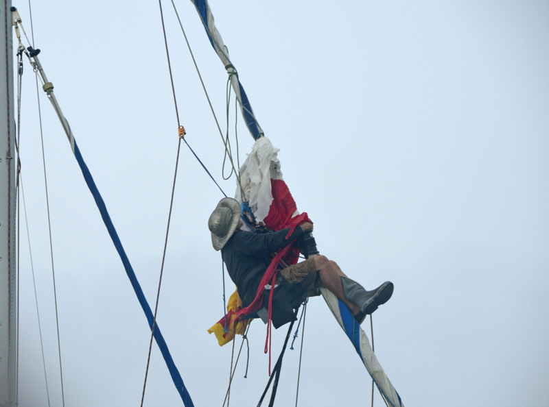 sailor up the rig hanging onto headstay.