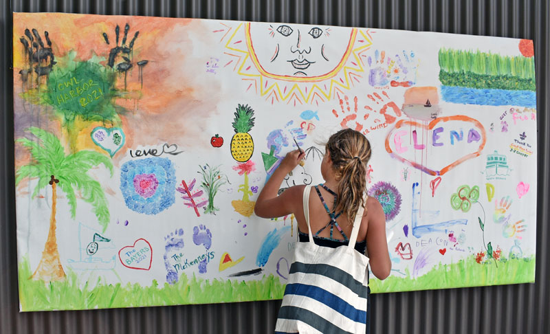 Girl working on group painting