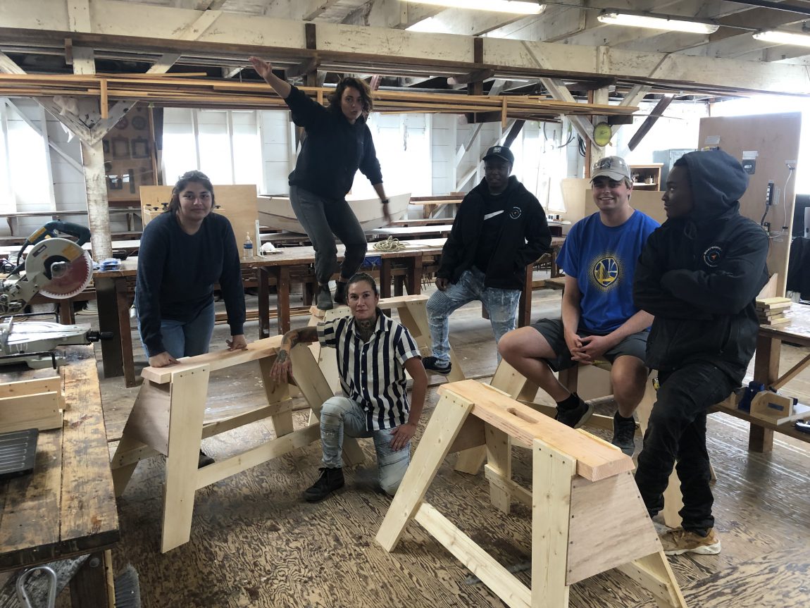 Apprentices with saw horses