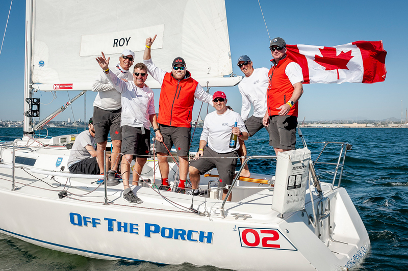 Andy Roy and crew with Canadian flag