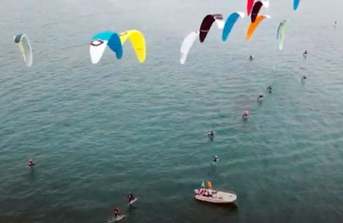 aerial of foiling kiteboarders