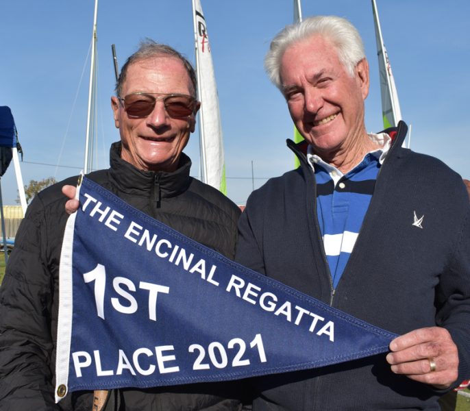 Klaus Schumann and Richard Atkinson with Encinal Regatta flag