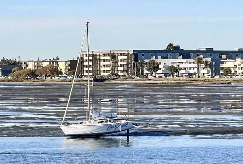 Out of Control aground in the mud