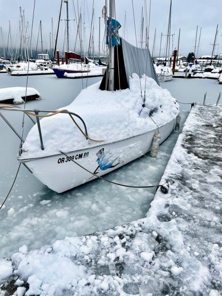 Sailboat frozen in ice