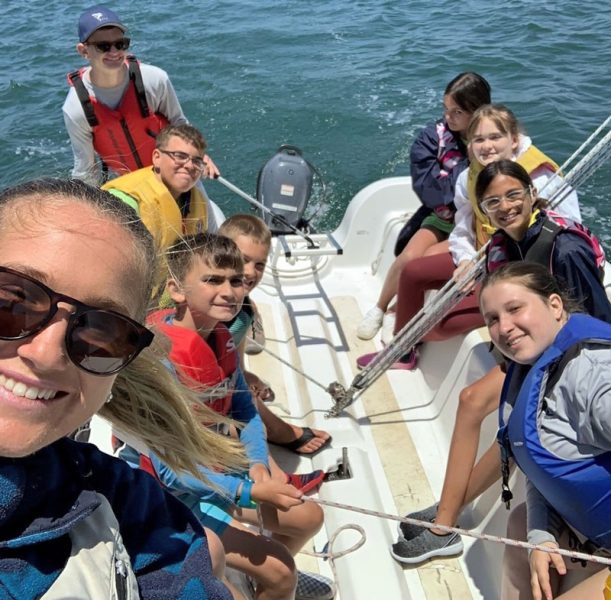 Young people in a keelboat cockpit