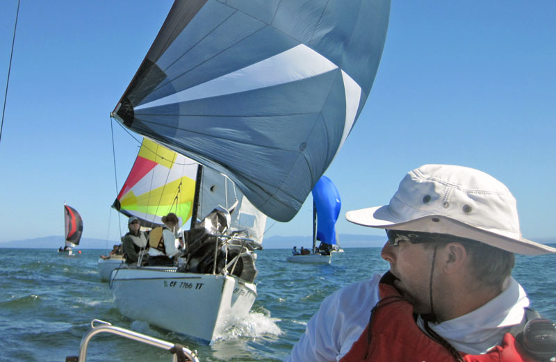 Mackenzie Cook at the helm, Moore 24s with spinnakers