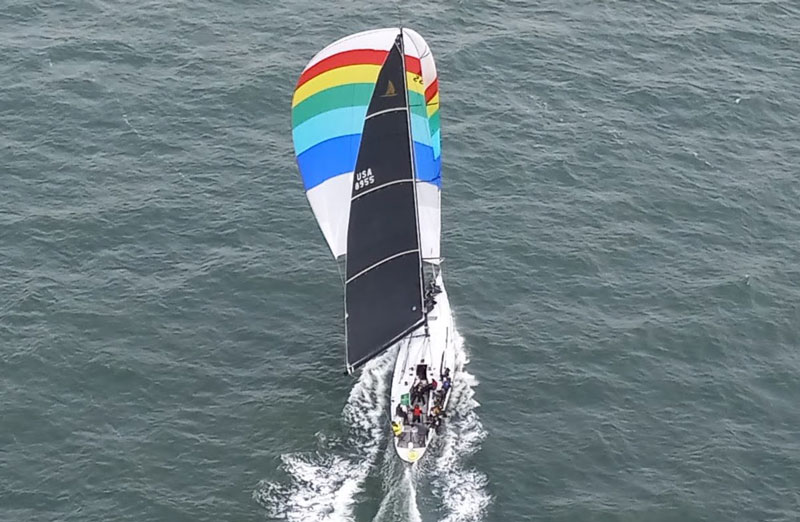 Merlin with rainbow spinnaker