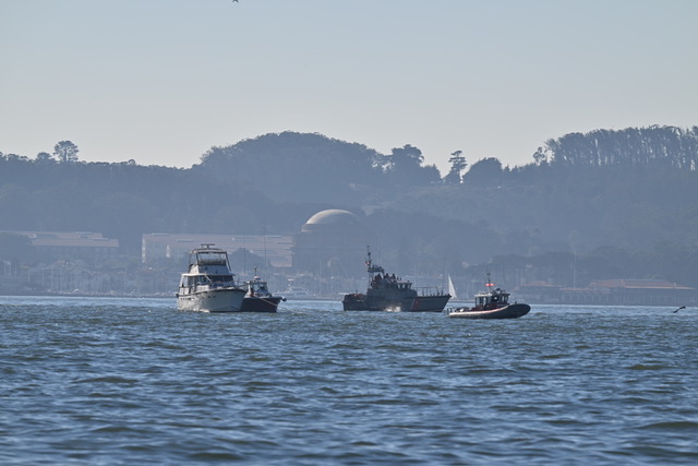 boat on rock and USCG rescue craft