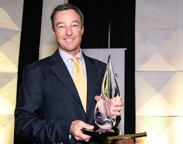 Mark Ivey with award