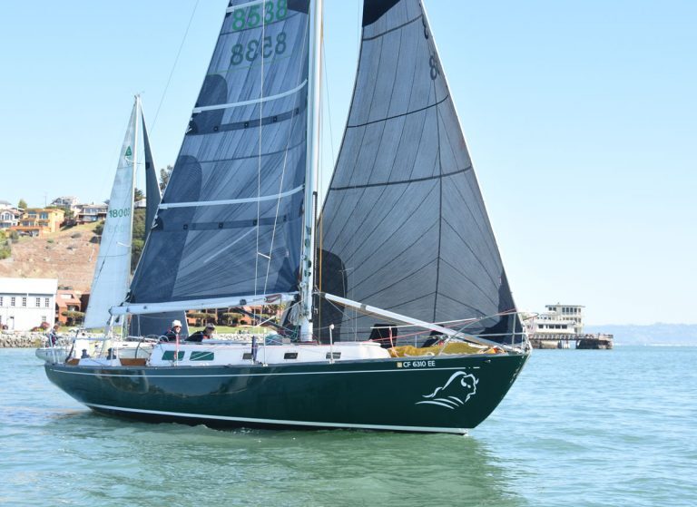 Green hulled sailboat